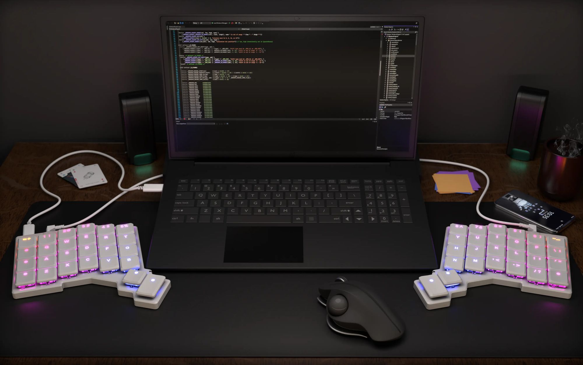 a Voyager keyboard sitting on a wooden café table connected to a laptop