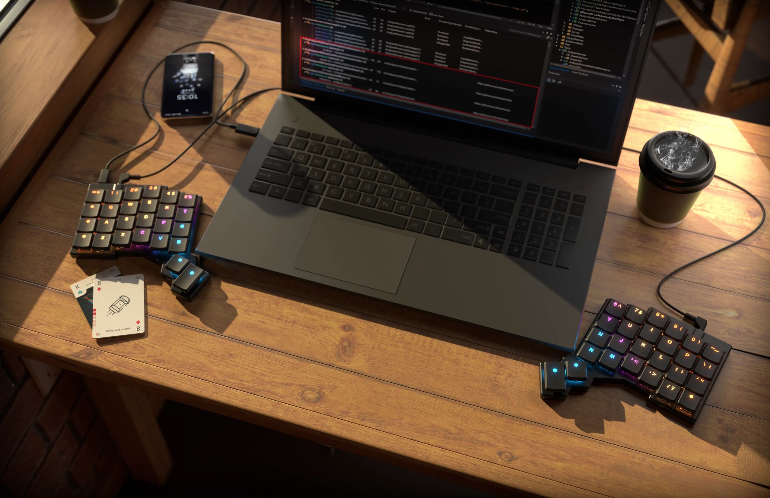 a Voyager keyboard sitting on a wooden café table connected to a laptop