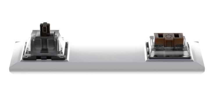 Two switcehs on a platform. MX-style switch on the left, choc switch on the right